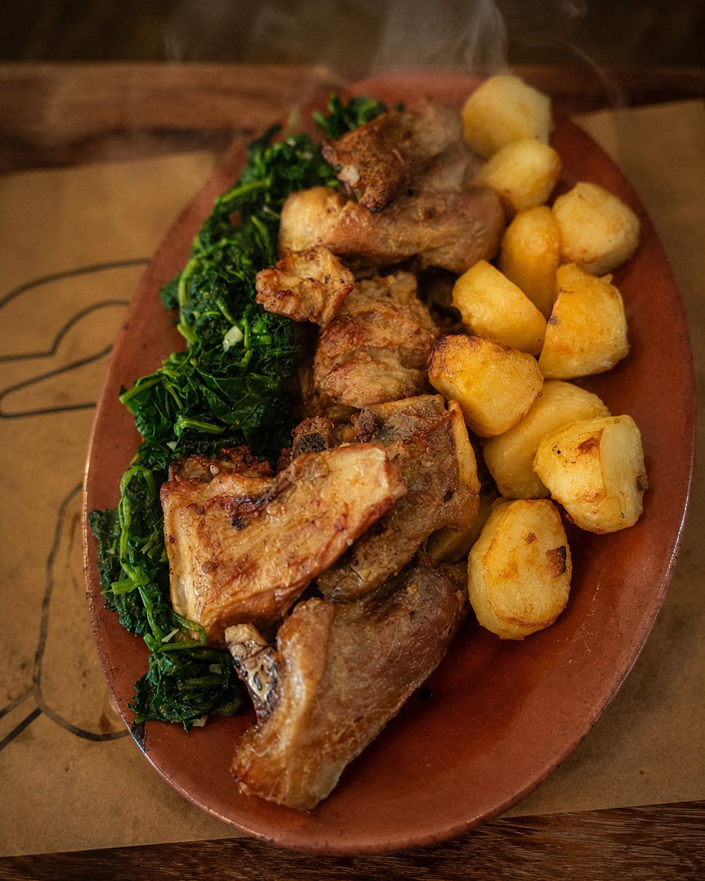 Cabrito assado com batatas e grelos